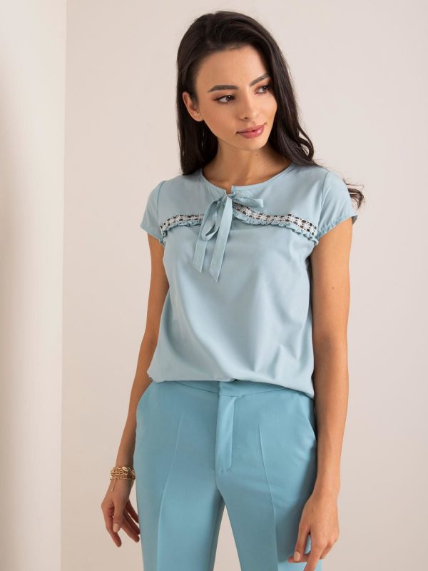 Nadine's light blue blouse