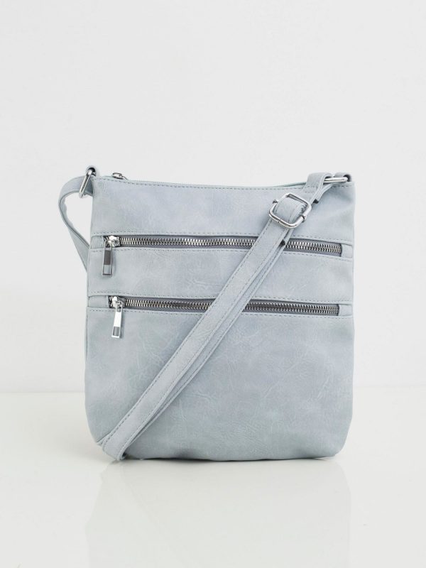 Light blue handbag with zippers