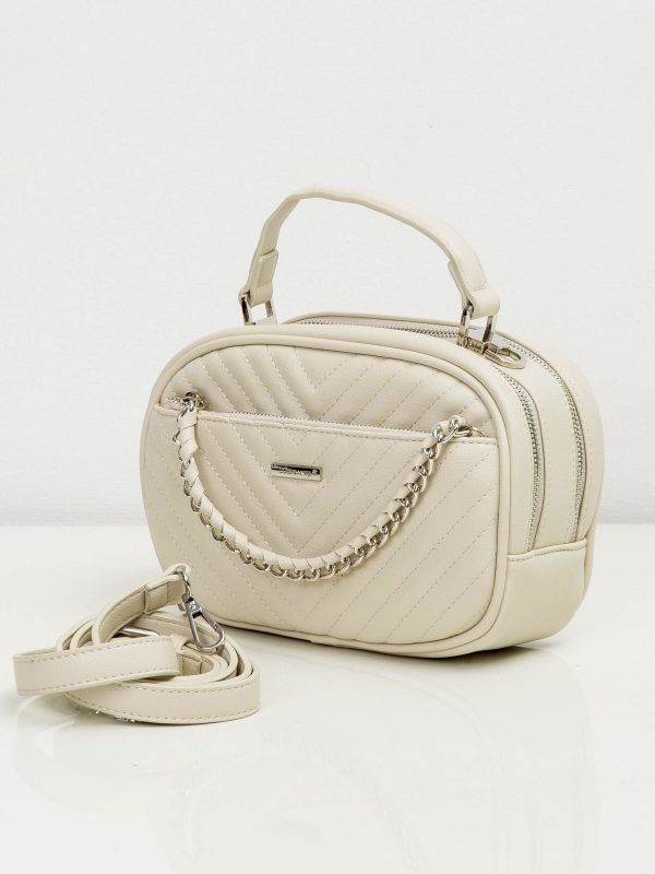 Cream handbag with decorative chain