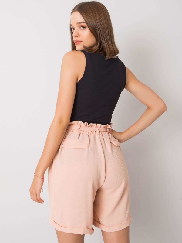 Pale pink shorts with Adaeh belt