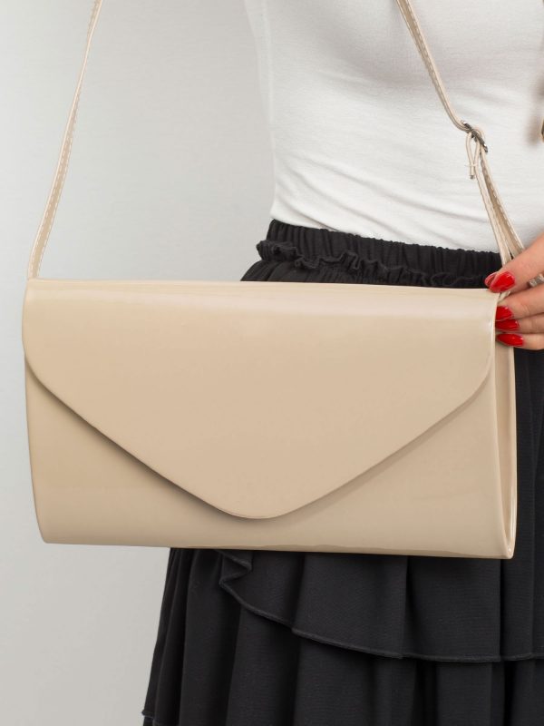 Beige oblong lacquered clutch bag