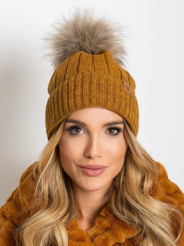 Dark yellow winter hat with tassel