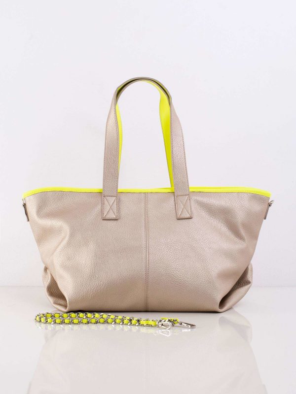 Gold bag with decorative strap