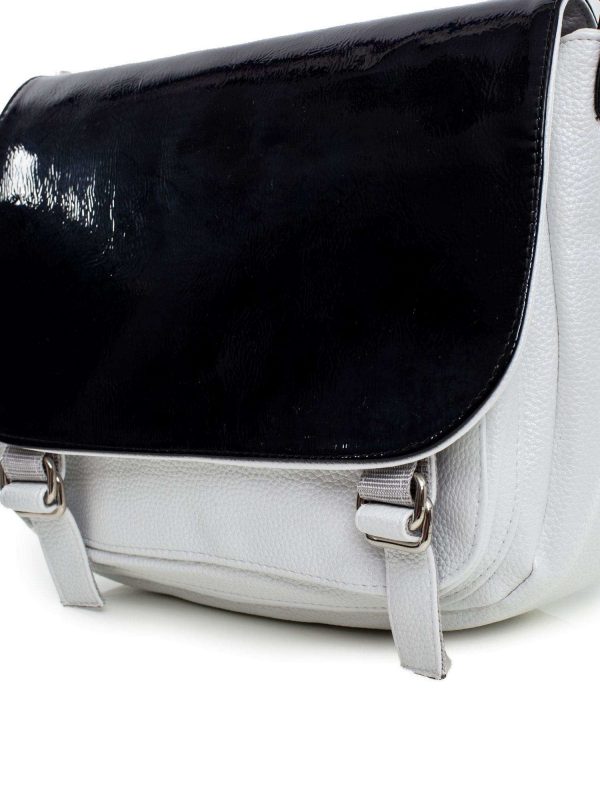 White and black women's bag with patent flap