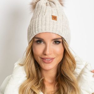 Beige winter hat with pompom