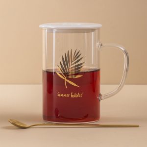 Glass mug with lid and spoon