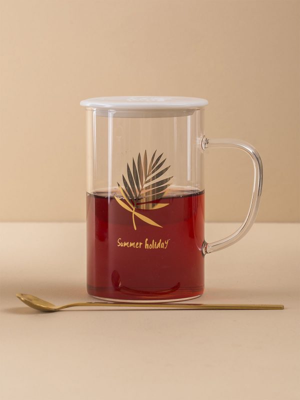 Glass mug with lid and spoon