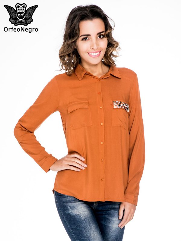 Orange blouse with jewellery pocket