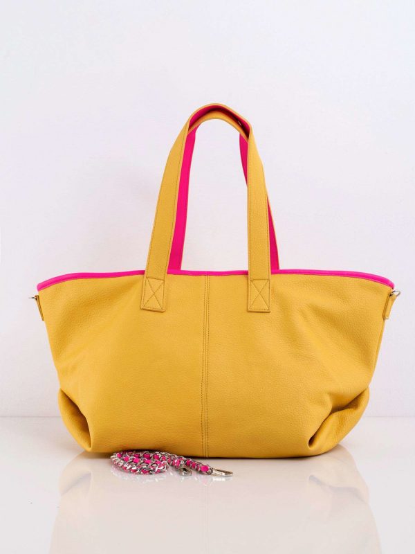 Yellow bag with decorative strap