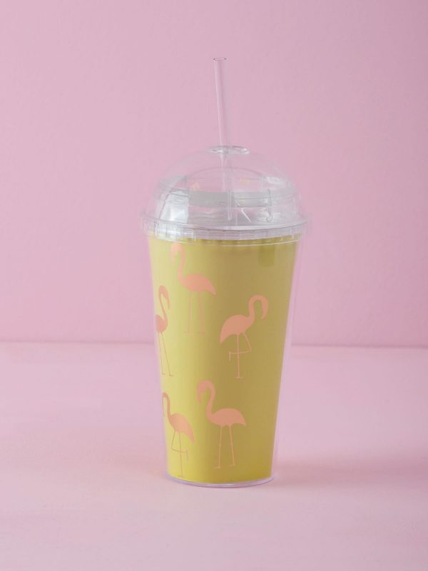 Yellow mug with lid and straw