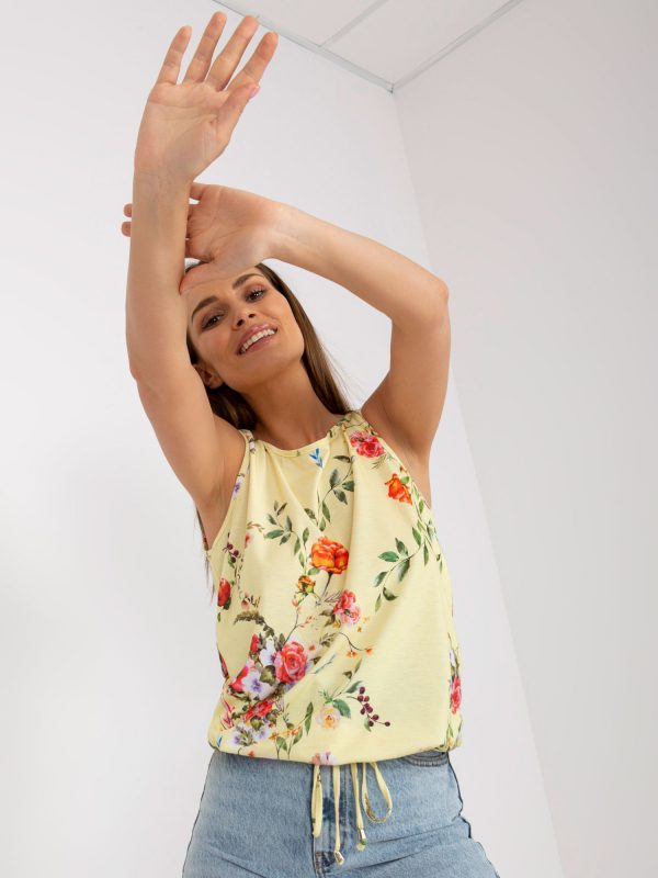 Light yellow patterned top with a neckline on the back