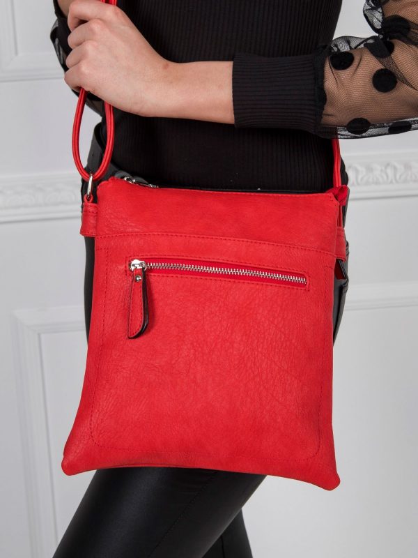 Red handbag with long strap