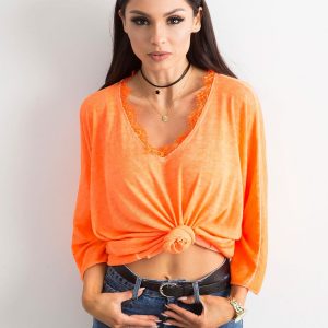 Fluo orange blouse with lace at the neckline