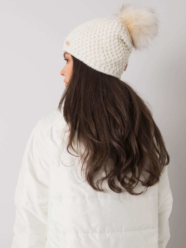 White winter hat with pompom