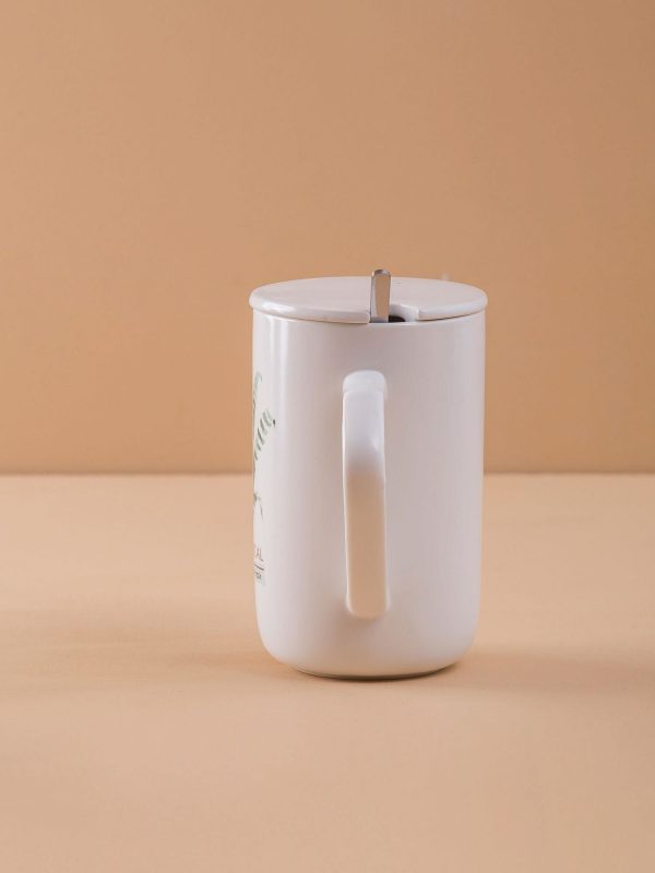 White ceramic mug with lid and print