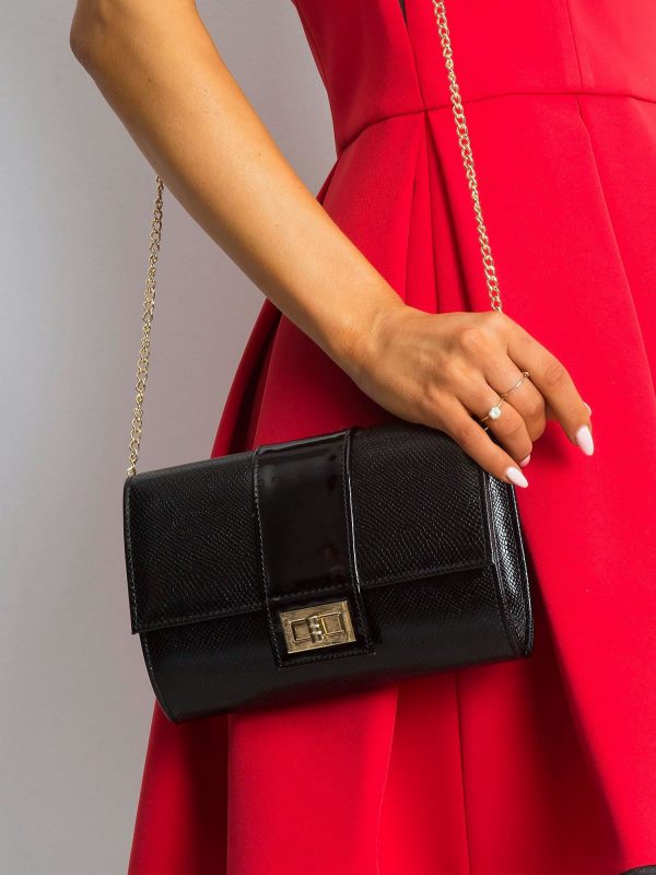 Black clutch bag on a chain