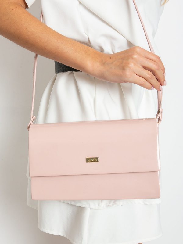 Light pink lacquered clutch bag