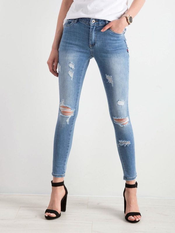 Blue denim pants with holes