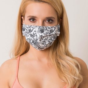 White and black protective mask in roses