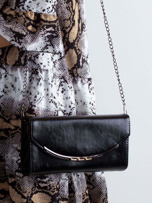 Black clutch bag on a chain