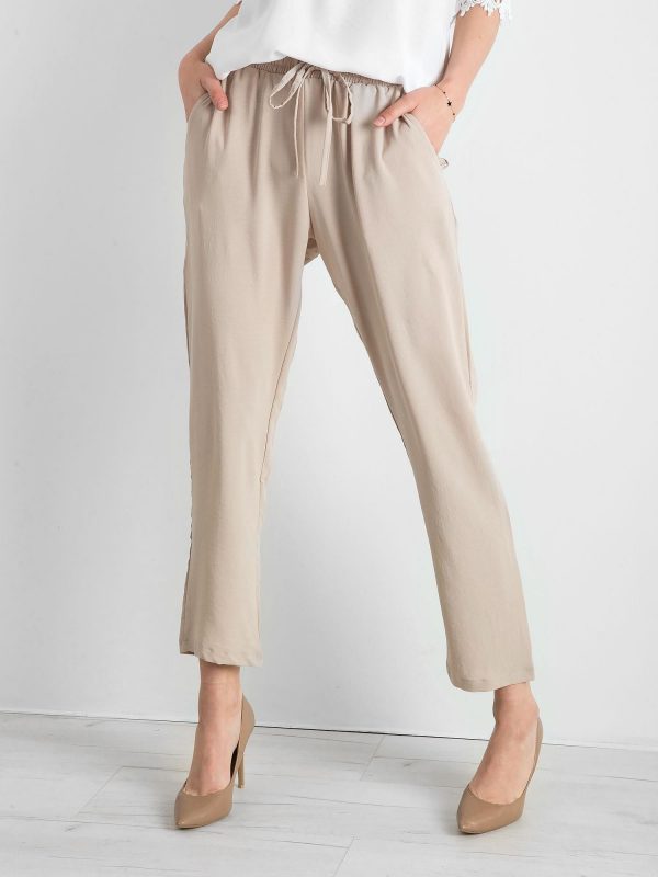Beige trousers with stripes