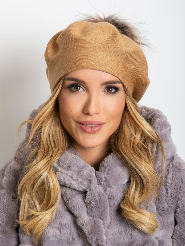 Beige knitted beret with pompom