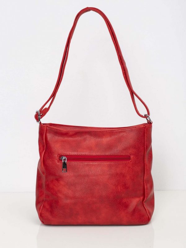 Red handbag with long strap