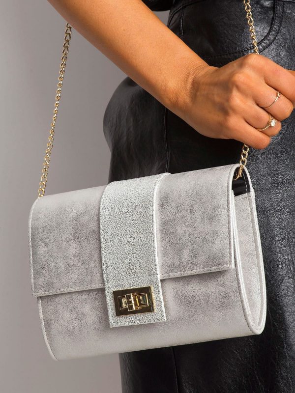 Silver clutch bag on a chain