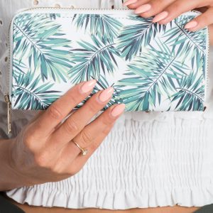 White-green wallet in leaves