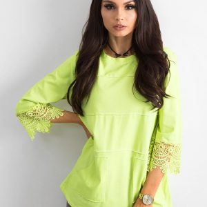 Light green blouse with lace and pockets