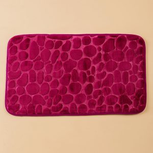 Burgundy bathroom mat with stone motif