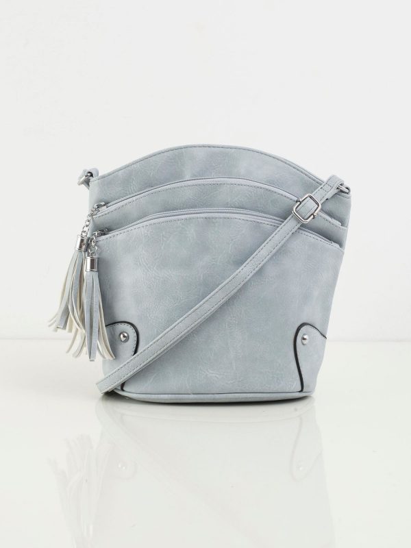 Light blue handbag with zippers