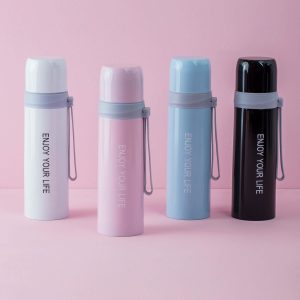 Light pink thermos with inscription