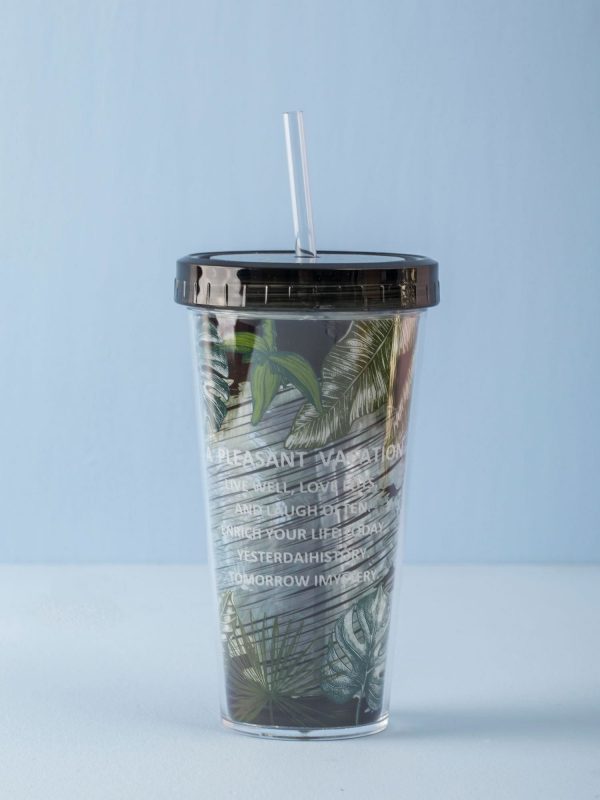 Black and green mug with straw