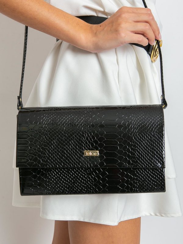 Black patent clutch bag with snake skin motif