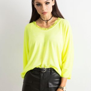 Fluo yellow blouse with lace at the neckline