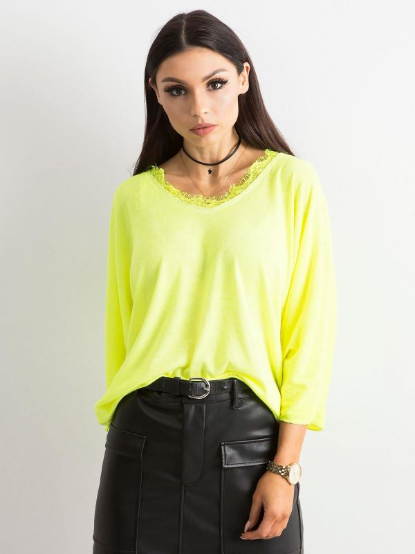 Fluo yellow blouse with lace at the neckline