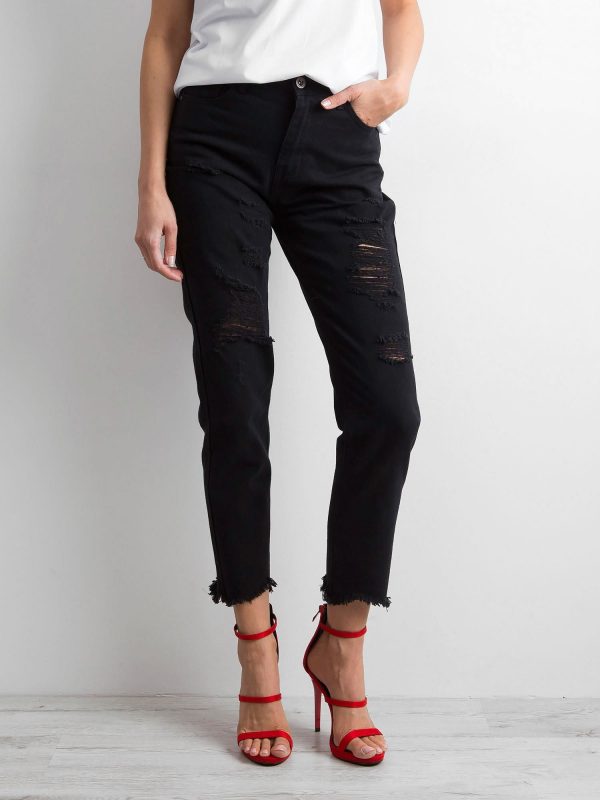 Black jeans with frayed leg