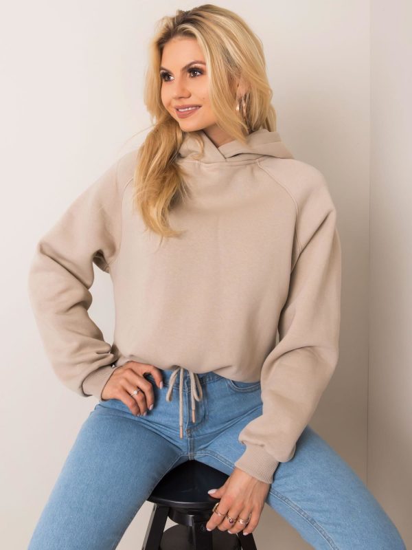 Nicole's beige sweatshirt