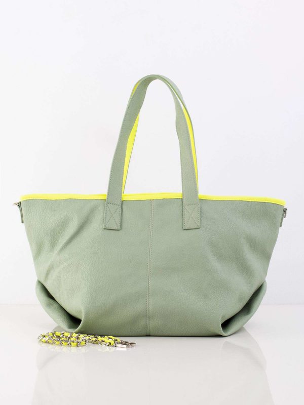 Green bag with decorative strap