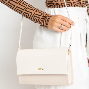 Cream clutch bag with detachable strap