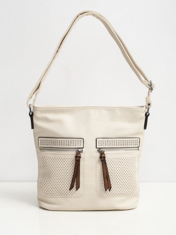 Beige bag with openwork pockets