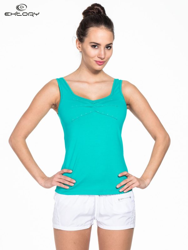 Green women's sports top with rhinestones