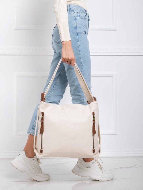 Light beige handbag with strap