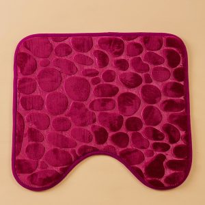 Burgundy bathroom mat under the toilet