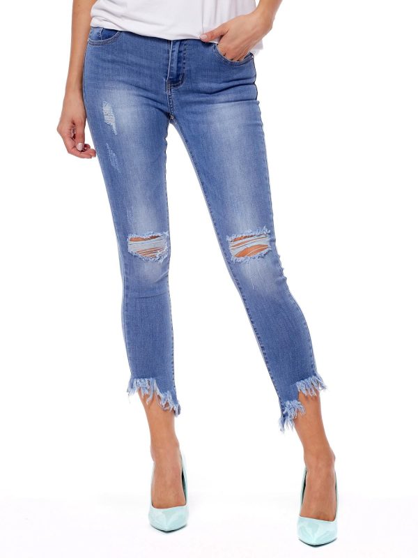 Wholesale Blue denim pants with frayed legs and holes