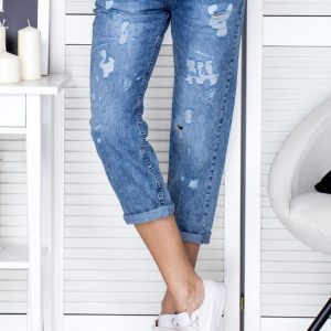 Wholesale Blue denim pants with decatization and rips