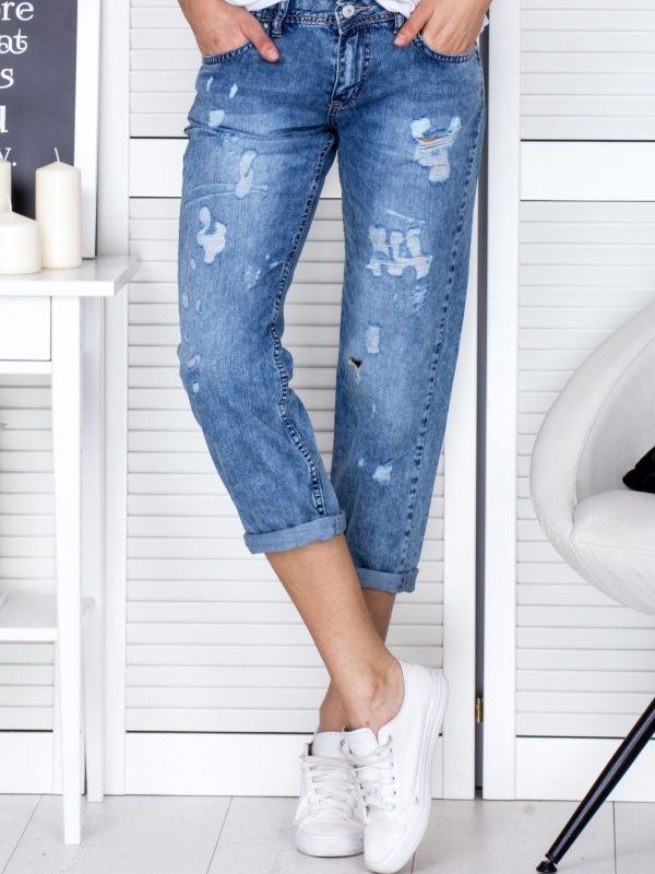 Wholesale Blue denim pants with decatization and rips