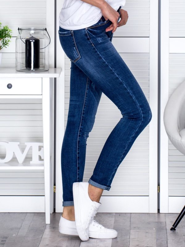 Wholesale Denim fitted trousers with abrasions blue