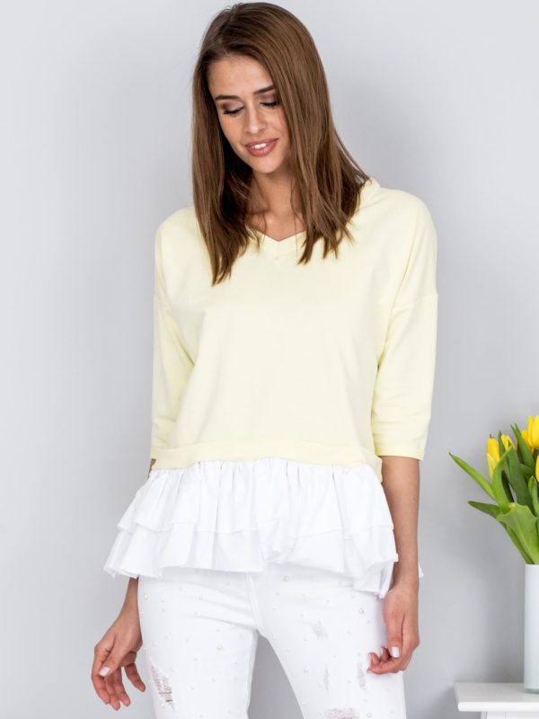 Wholesale Blouse light yellow V-neck with contrasting frill